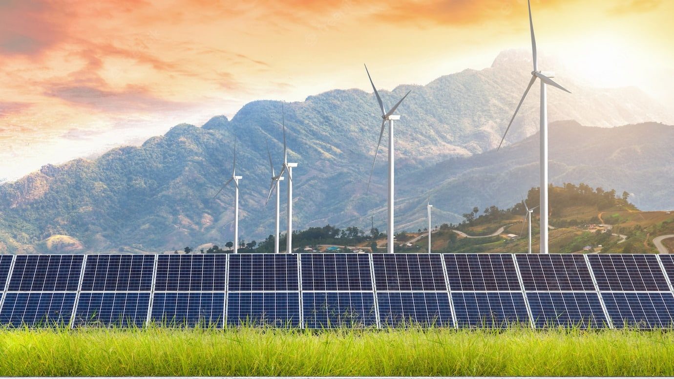 road with solar panels with wind turbines against mountanis landscape against sunset sky 29332 1361