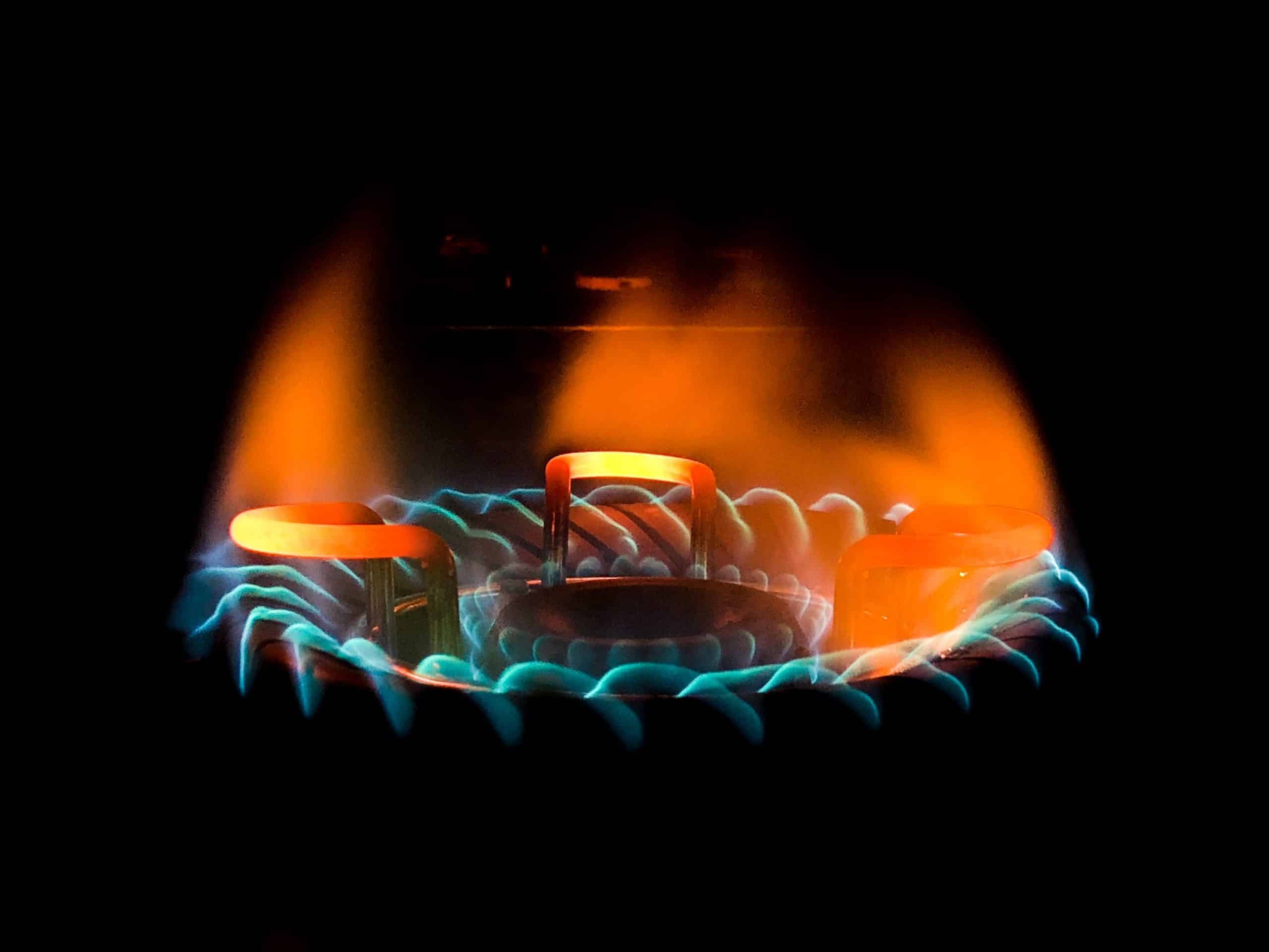 closeup shot beautiful blue green flame gas stove