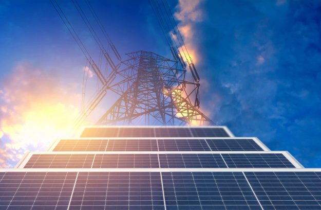 high voltage pole with solar cell blue sky background energy power concept