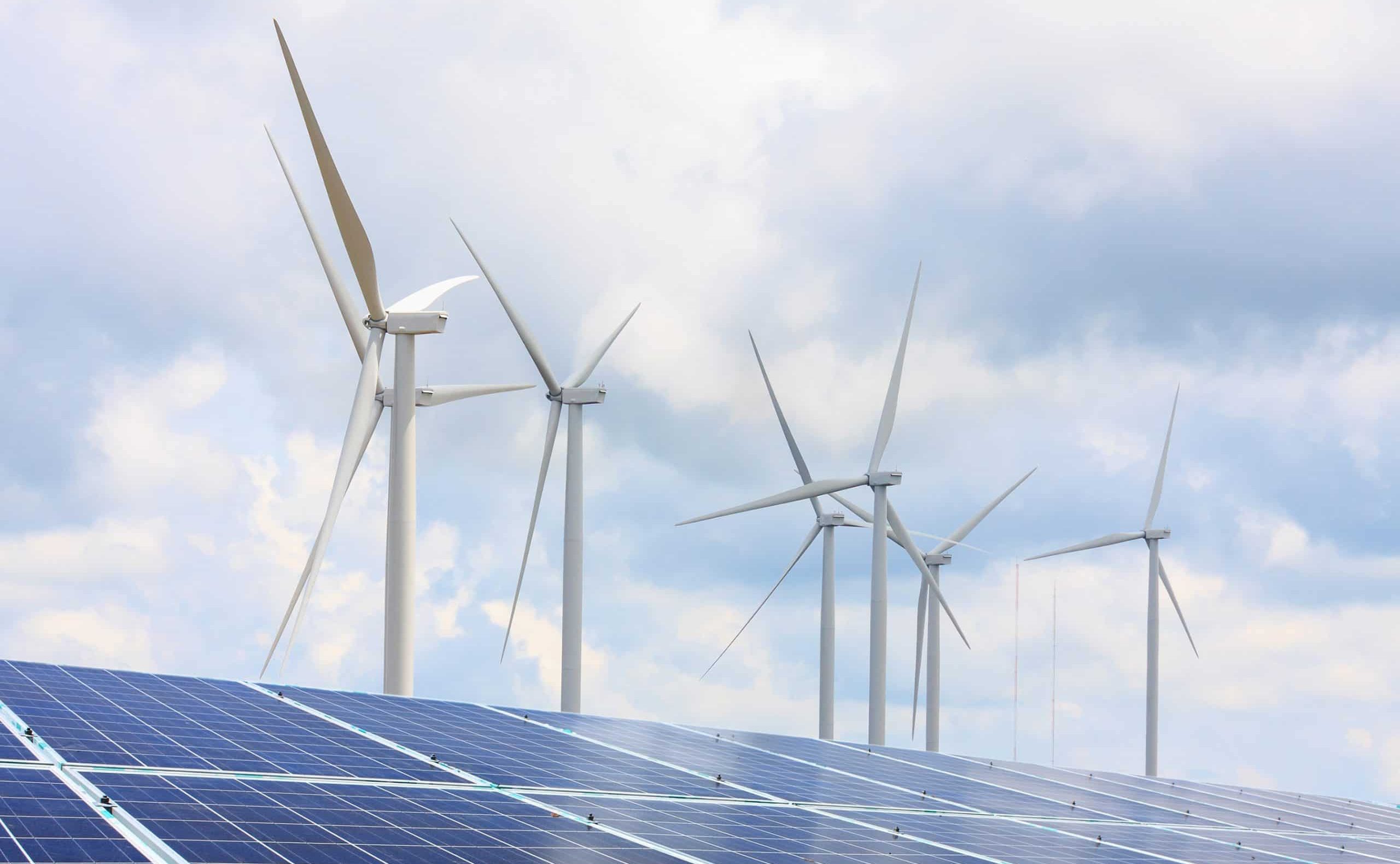 solar panels wind turbines with clouds sky renewable energy